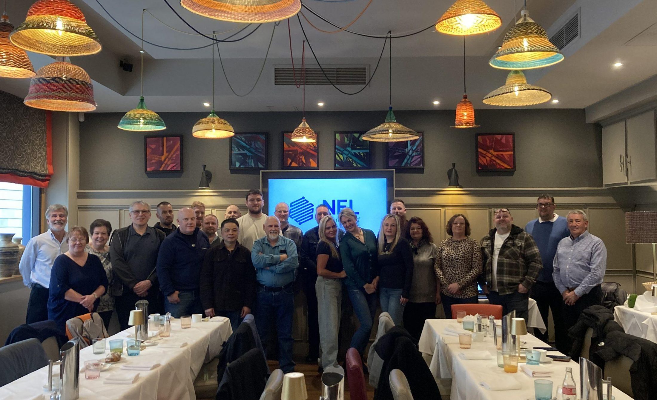 NEL team group photo at a company event